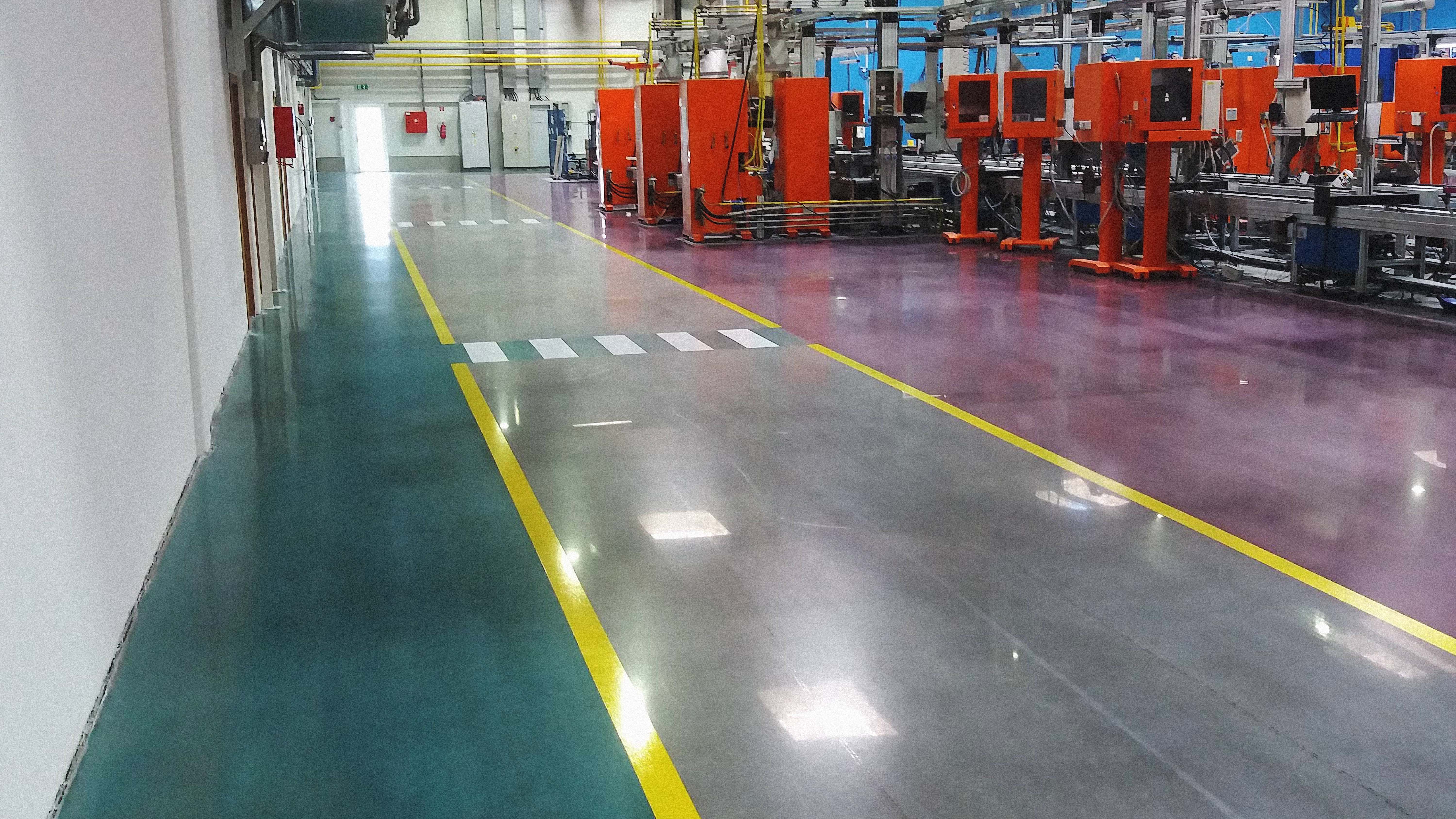 Image of concrete flooring inside a large industrie hall