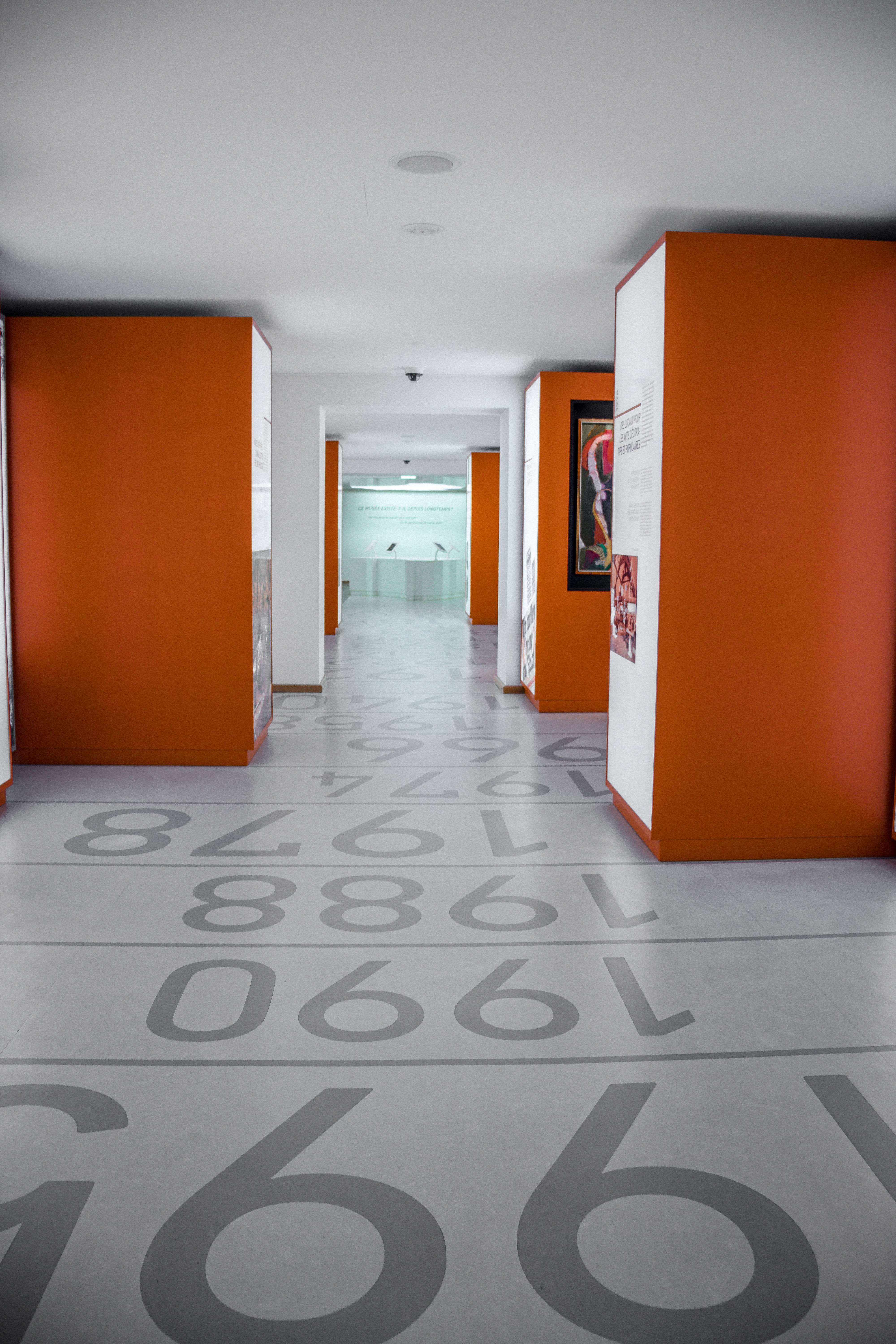 Image of colored numbers in concrete flooring